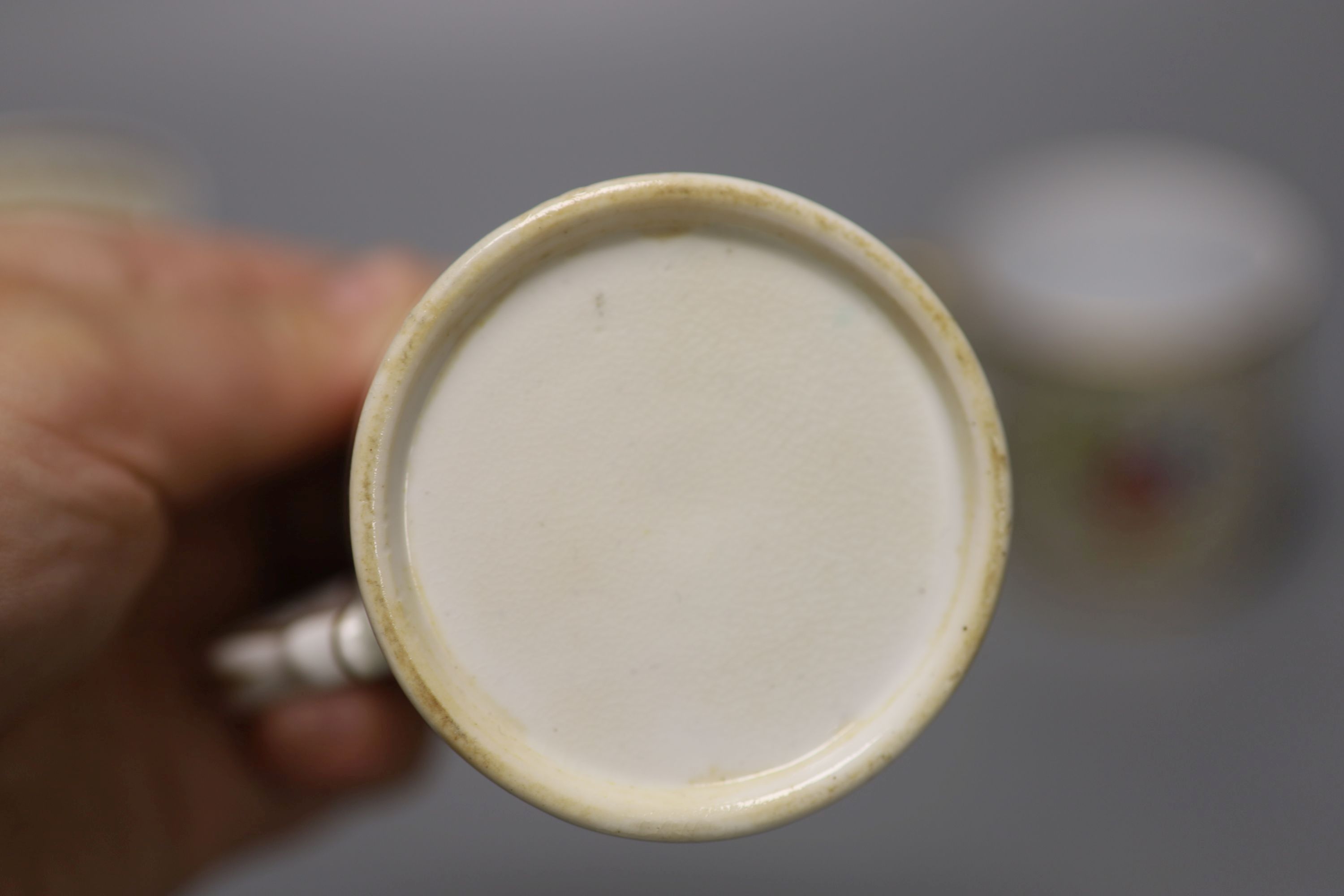 A Spode fine cup and saucer decorated with raised gilding in neo-classical style pattern Spode 4327 in red,